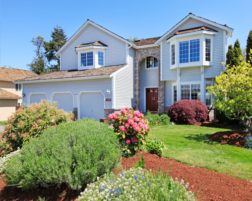 Photo of home with nice landscaping 